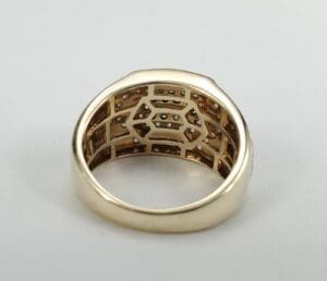 Gold ring with intricate inner design.