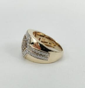 Gold ring with diamond accents on side.