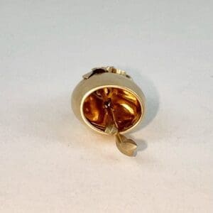 Gold-colored ring with decorative arrow design.