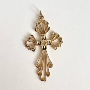 Ornate gold wire cross pendant design.