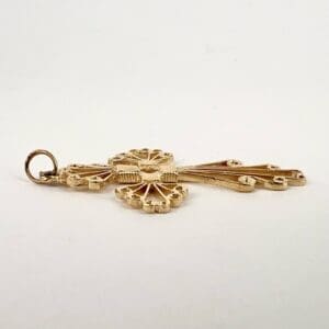 Ornate gold key with decorative design.