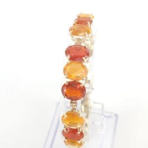 Bracelet with orange and yellow gemstones.
