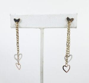 Gold chain earrings with heart charms.