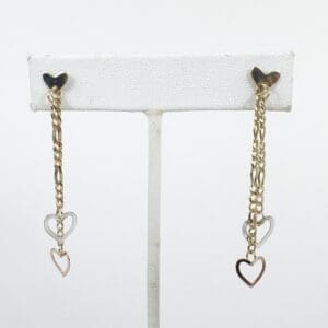 Gold chain earrings with heart charms.