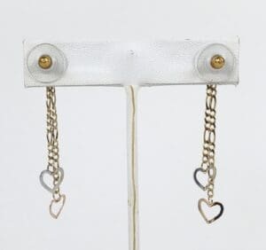 Gold chain earrings with heart pendants.