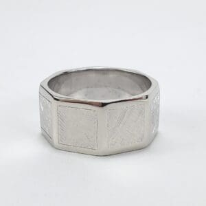 Silver geometric band with textured design.