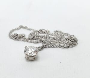 Silver necklace with a diamond pendant.