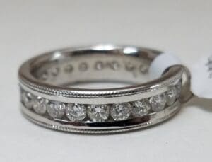 Silver ring with embedded diamonds.