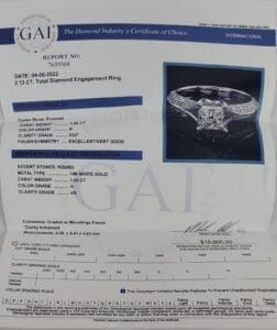 Diamond certificate with engagement ring image.