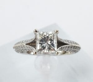Princess-cut diamond engagement ring on display.
