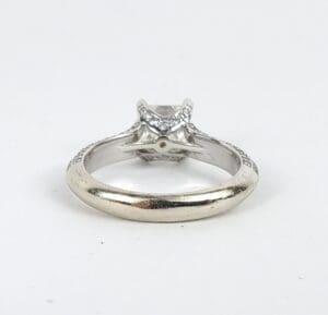 Silver ring with diamond setting, rear view.