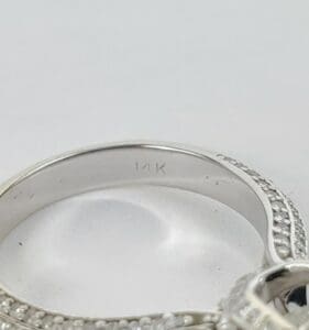 Silver ring with "14K" engraving inside band.