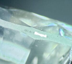 Close-up of diamond with engraved details.