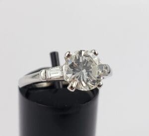 Diamond engagement ring with silver band.