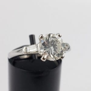 Diamond engagement ring with silver band.