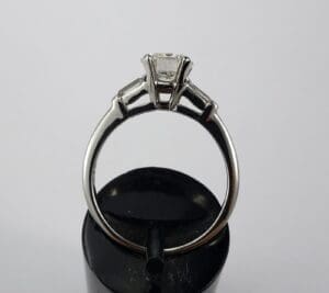Silver engagement ring with diamond setting.