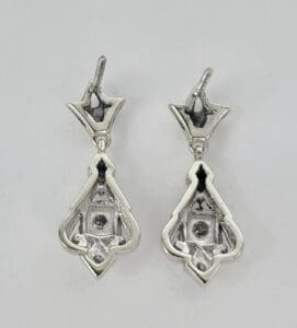Silver drop earrings with geometric design.