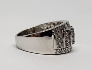 Silver ring with small embedded diamonds.