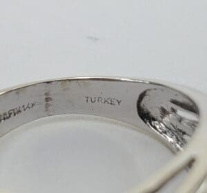 Silver ring with "Turkey" engraved inside.