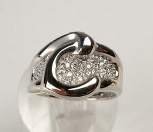 Silver ring with sparkling diamond accents.