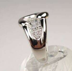 Silver ring with textured design on display.