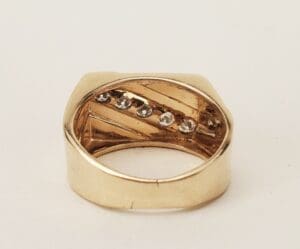 Gold ring with embedded small diamonds.