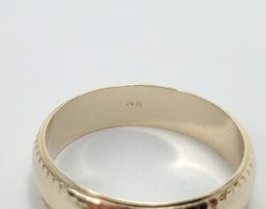 Gold ring with "14K" hallmark inside.