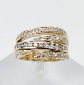 Gold ring with multiple diamond-studded bands.