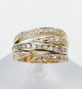 Gold ring with multiple diamond bands.