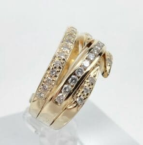 Gold ring with multiple diamond-studded bands.