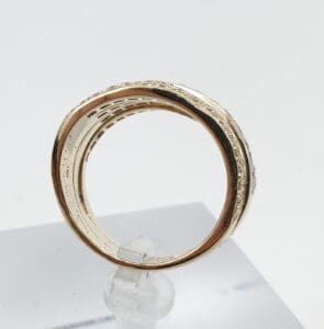 Gold ring with intricate engraved details.