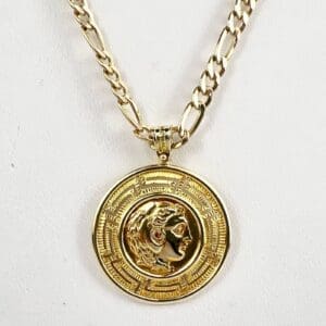 Gold chain with medallion pendant design.