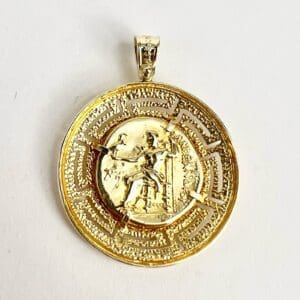 Gold medallion with intricate design and figures.