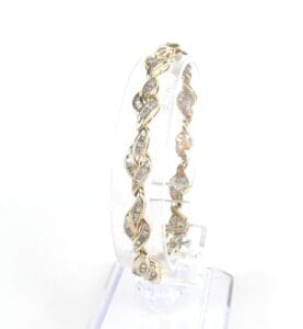 Gold bracelet with intricate twisted design.