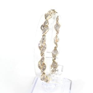Gold bracelet with intricate twisted design.