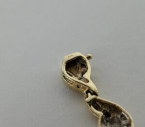 Gold jewelry clasp with 14k marking.