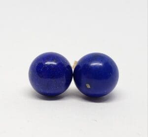 Two blue spherical lapis lazuli beads.