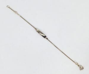 Gold chain bracelet on white background.