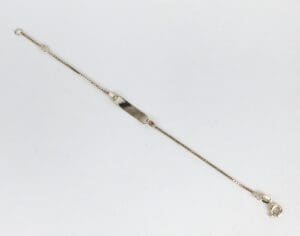 Gold chain bracelet with nameplate and clasp.