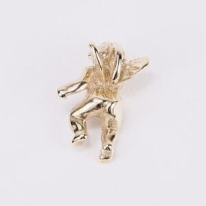 Golden angel brooch on white background.