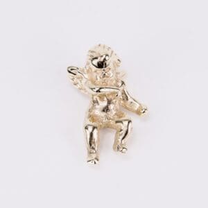 Gold cherub figurine on white background.