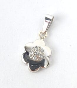 Flower-shaped silver pendant with rhinestones.