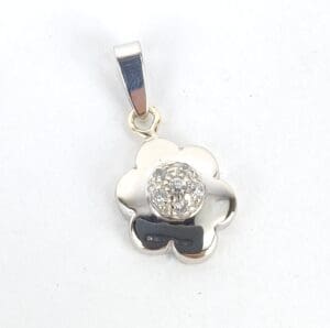 Silver flower-shaped pendant with central gemstone.