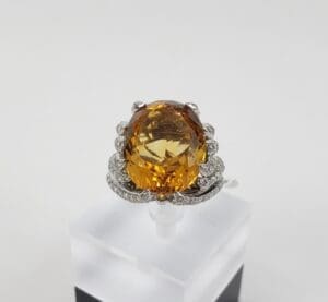 Gold gemstone ring with diamond accents.