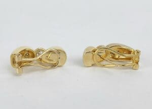 Gold clip-on earrings with looped design.