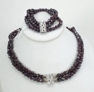 Garnet necklace and bracelet with silver clasps.