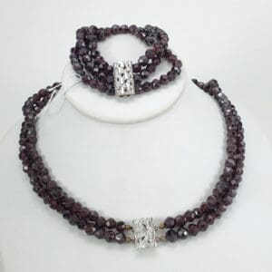 Garnet necklace and bracelet with silver clasps.