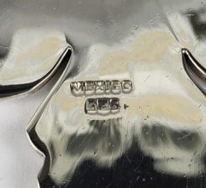 Silver hallmark stamped "Mexico 925" on metal.