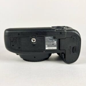 Bottom view of a black DSLR camera.