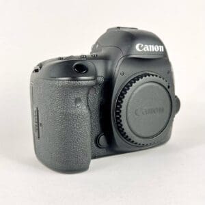 Canon DSLR camera body on white background.